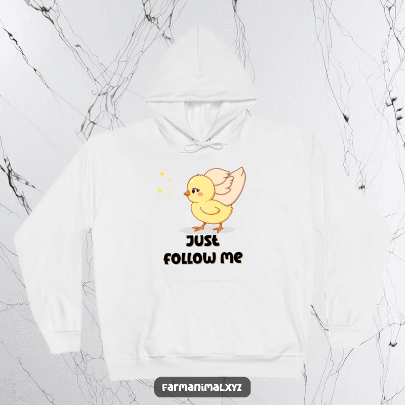 Funny chick snuggled close to its mother on a cozy hoodie, depicting a sweet and humorous bond.