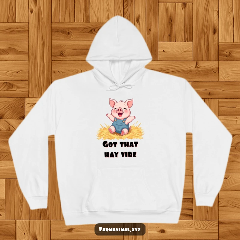 Funny piglet hoodie depicting a happy piglet wearing overalls, blissfully rolling around in soft hay.