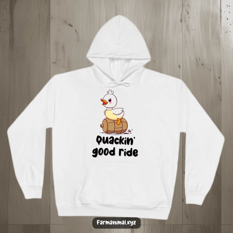 Funny Duck Hoodie: A duck character gleefully riding on a rolling barrel, offering cozy, humorous comfort.